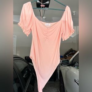 Never worn body suit